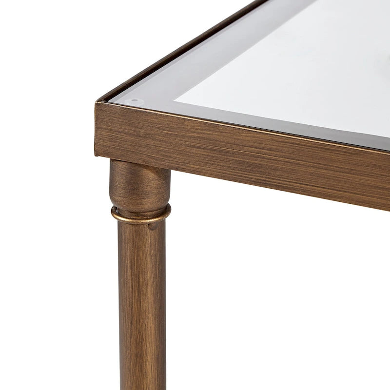 Table basse avec plateau en verre et piètement en X en bronze